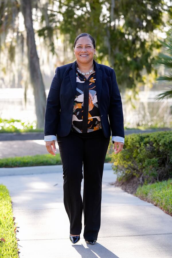 Marisol Ortega, a Polk County resident that commutes to her job in Orlando walks at a park Thursday, Nov. 14, 2024, in Orlando, Fla. (AP Photo/John Raoux)