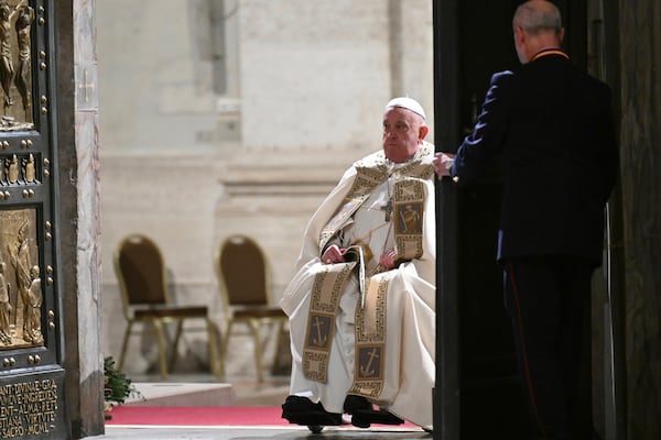 Pope Francis opens the Holy Door of St Peter's Basilica to mark the start of the Catholic Jubilee Year, at the Vatican, Dec. 24, 2024. (Alberto Pizzoli/Pool Photo via AP)