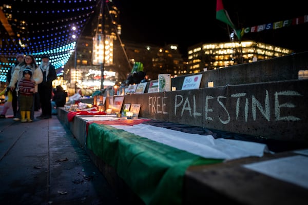 People gather to celebrate the Gaza ceasefire and hostage deal reached between Israel and Hamas in Vancouver, British Columbia, Wednesday, Jan. 15, 2025. (Ethan Cairns/The Canadian Press via AP)