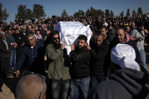 Members of the Bedouin community carry the body of Yosef Al Zaydani, who was in Hamas captivity in the Gaza Strip, a day after the Israeli army said his body was recovered in an underground tunnel in southern Gaza, during his funeral in Rahat, southern Israel, Thursday, Jan. 9, 2025. (AP Photo/Mahmoud Illean)