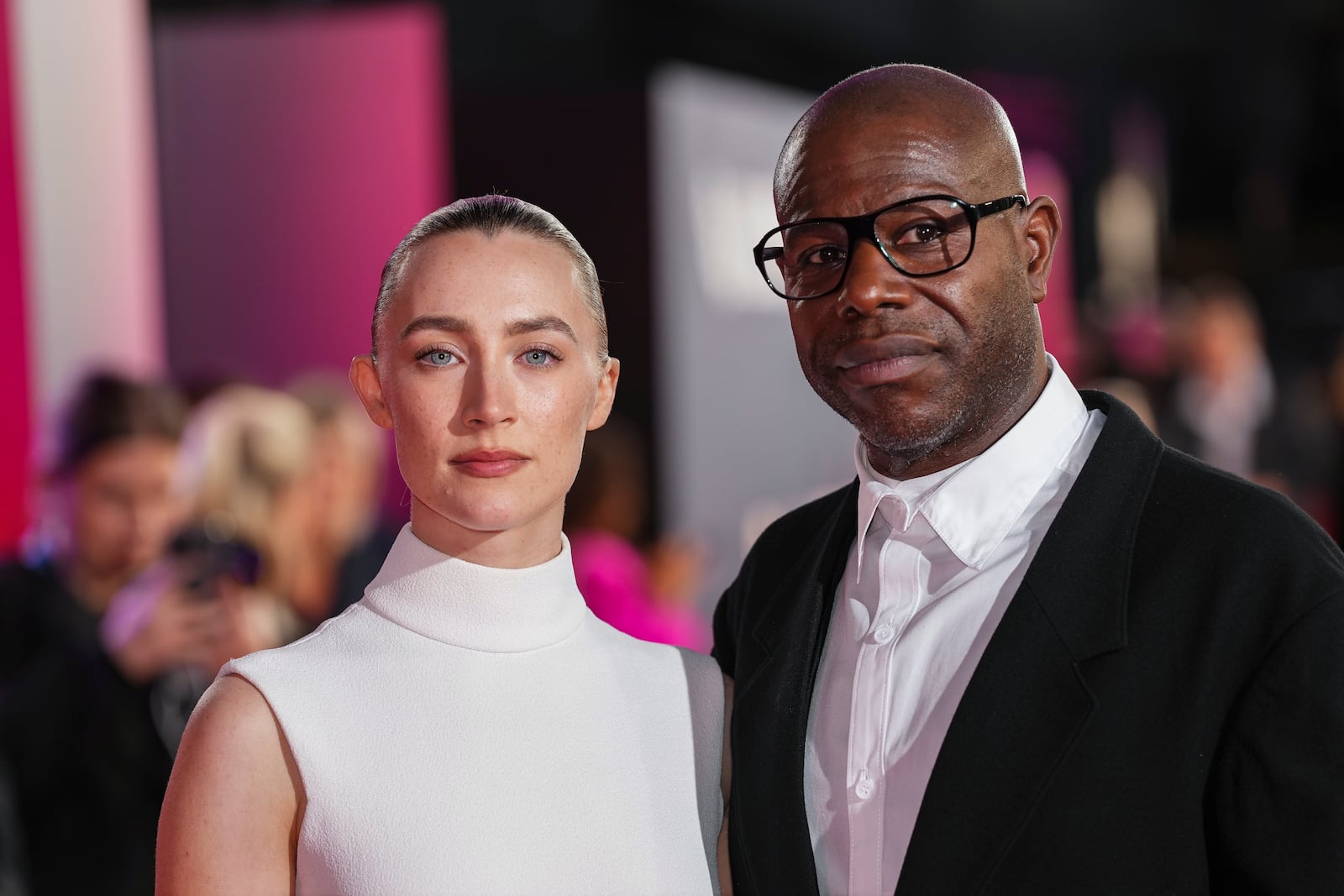 Saoirse Ronan, left, and director Steve McQueen pose for photographers upon arrival at the premiere for the film 'Blitz' and the opening gala of the London Film Festival on Wednesday, Oct. 9, 2024, in London. (Photo by Scott A Garfitt/Invision/AP)