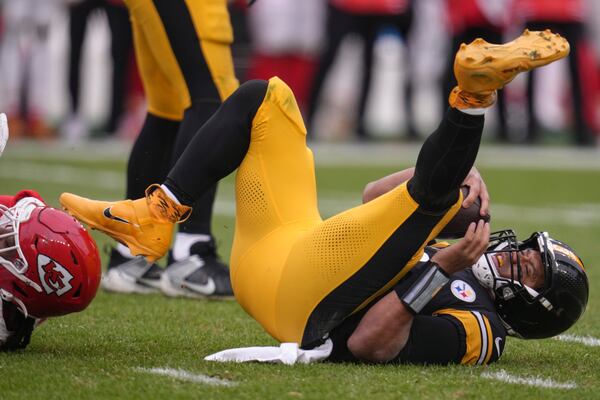 Pittsburgh Steelers quarterback Russell Wilson (3) is sacked by Kansas City Chiefs defensive end Mike Danna (51) during the second half of an NFL football game, Wednesday, Dec. 25, 2024, in Pittsburgh. (AP Photo/Gene J. Puskar)