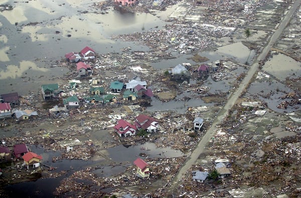 Destroyed houses are seen in this aerial view of the town of Meulaboh in Aceh province, Indonesia, which was flattened by tidal waves, on Saturday, Jan. 1, 2005. (AP Photo/Dudi Anung, File)