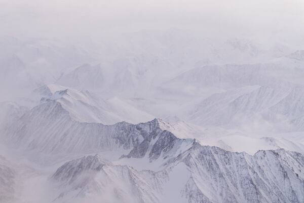 Snow covers the mountains of the Brooks Range in the Arctic National Wildlife Refuge, Monday, Oct. 14, 2024, near Kaktovik, Alaska. (AP Photo/Lindsey Wasson)