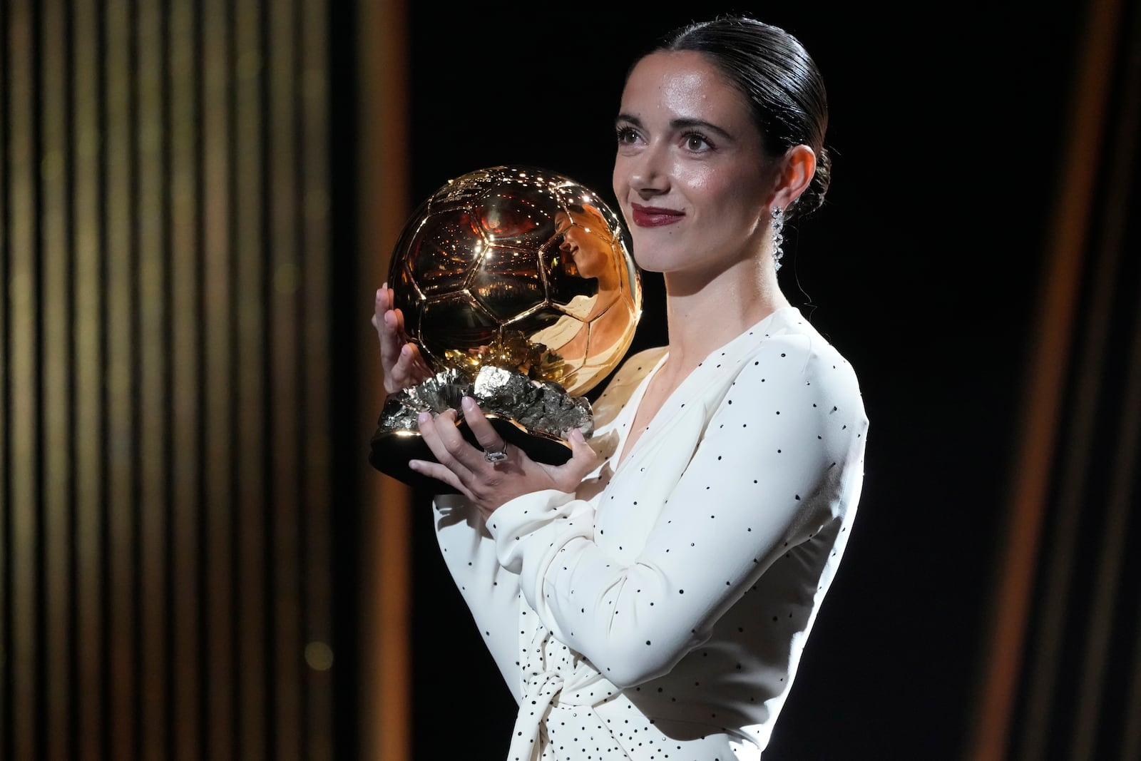 Barcelona's Aitana Bonmati, receives the 2024 Women's Ballon d'Or award during the 68th Ballon d'Or (Golden Ball) award ceremony at Theatre du Chatelet in Paris, Monday, Oct. 28, 2024. (AP Photo/Michel Euler)