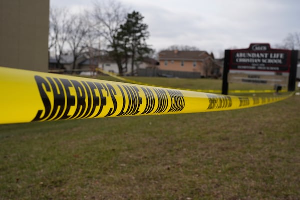 Police tape is seen outside the Abundant Life Christian School Tuesday, Dec. 17, 2024 in Madison, Wis., following a shooting on Monday. (AP Photo/Morry Gash)