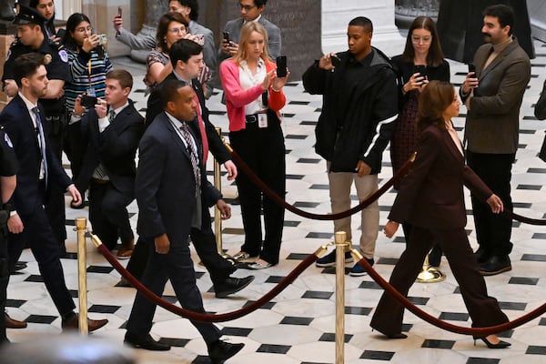 Vice President Kamala Harris, right, walks through Statuary Hall to the House Chamber before a joint session of Congress convenes to confirm the Electoral College votes, affirming President-elect Donald Trump’s victory in the presidential election, Monday, Jan. 6, 2025, at the U.S. Capitol in Washington. (AP Photo/John McDonnell)