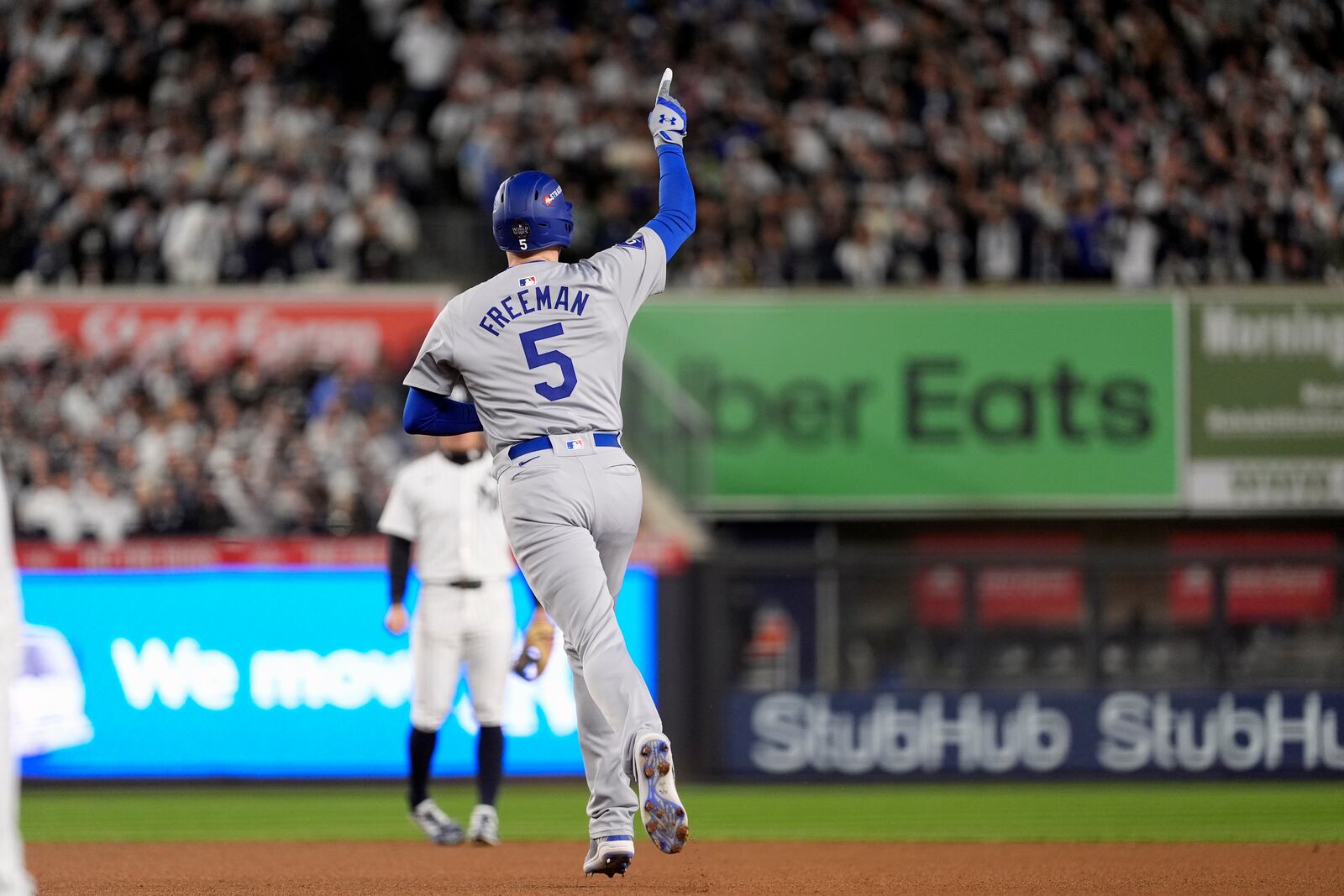 Los Angeles Dodgers' Freddie Freeman (5) celebrates after hitting a two-run home run against the New York Yankees during the first inning in Game 3 of the baseball World Series, Monday, Oct. 28, 2024, in New York. (AP Photo/Godofredo A. Vásquez)