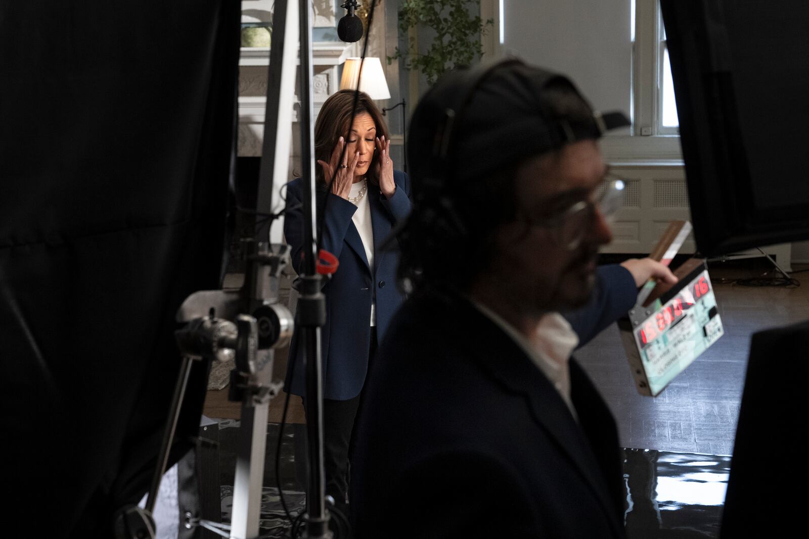 Democratic presidential nominee Vice President Kamala Harris rubs her eyes during a split second break while recording a campaign video, "direct to camera," Tuesday, Oct. 29, 2024, in Washington, ahead of her speech on the ellipse. (AP Photo/Jacquelyn Martin)