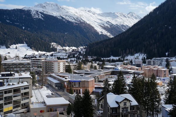 The mountains above the village of Davos, with the The Congress Center, center, where the annual meeting of World Economic Forum will take place, are covered with snow, in Davos, Switzerland, Sunday, Jan. 19, 2024. (AP Photo/Markus Schreiber)