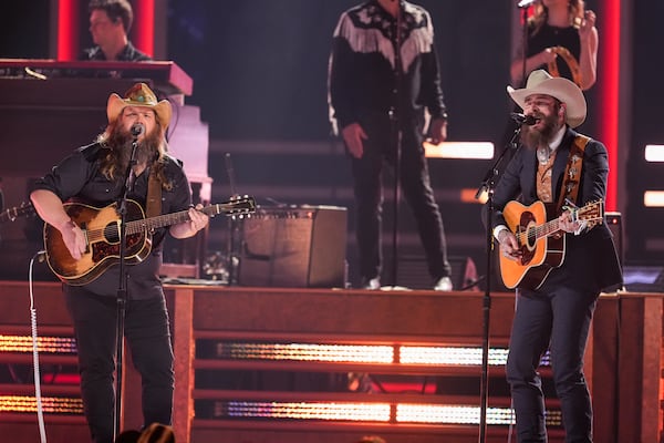 Chris Stapleton, left, and Post Malone perform during the 58th Annual CMA Awards on Wednesday, Nov. 20, 2024, at Bridgestone Arena in Nashville, Tenn. (AP Photo/George Walker IV)