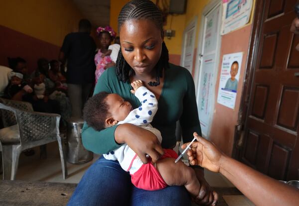 A health worker administers the malaria vaccine R21/Matrix-M to a child at the comprehensive Health Centre in Agudama-Epie, in Yenagoa, Nigeria, Monday, Dec. 9, 2024. (AP Photo/Sunday Alamba)