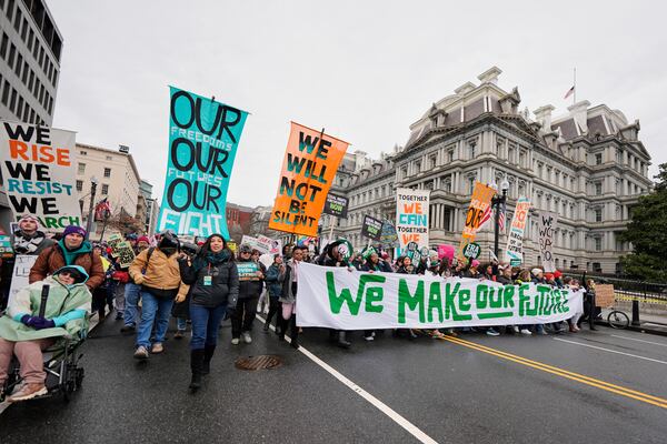 People march in the People's March, Saturday, Jan. 18, 2025, in Washington. (AP Photo/Mike Stewart)