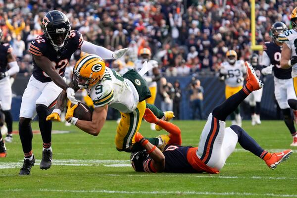 Chicago Bears' Kyler Gordon tackles Green Bay Packers' Christian Watson after a catch during the second half of an NFL football game Sunday, Nov. 17, 2024, in Chicago. (AP Photo/Nam Y. Huh)