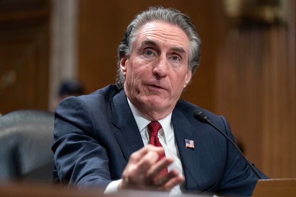 Former Gov. Doug Burgum, President-elect Donald Trump's choice to lead the the Interior Department as Secretary of the Interior, testifies before the Senate Energy and Natural Resources Committee on Capitol Hill in Washington, Thursday, Jan. 16, 2025. (AP Photo/Jose Luis Magana)