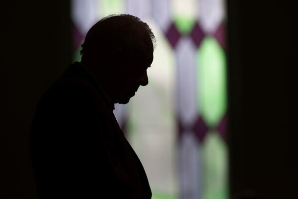 FILE - Former President Jimmy Carter prays during Sunday school class at Maranatha Baptist Church in his hometown, Dec. 13, 2015, in Plains, Ga. (AP Photo/Branden Camp, File)