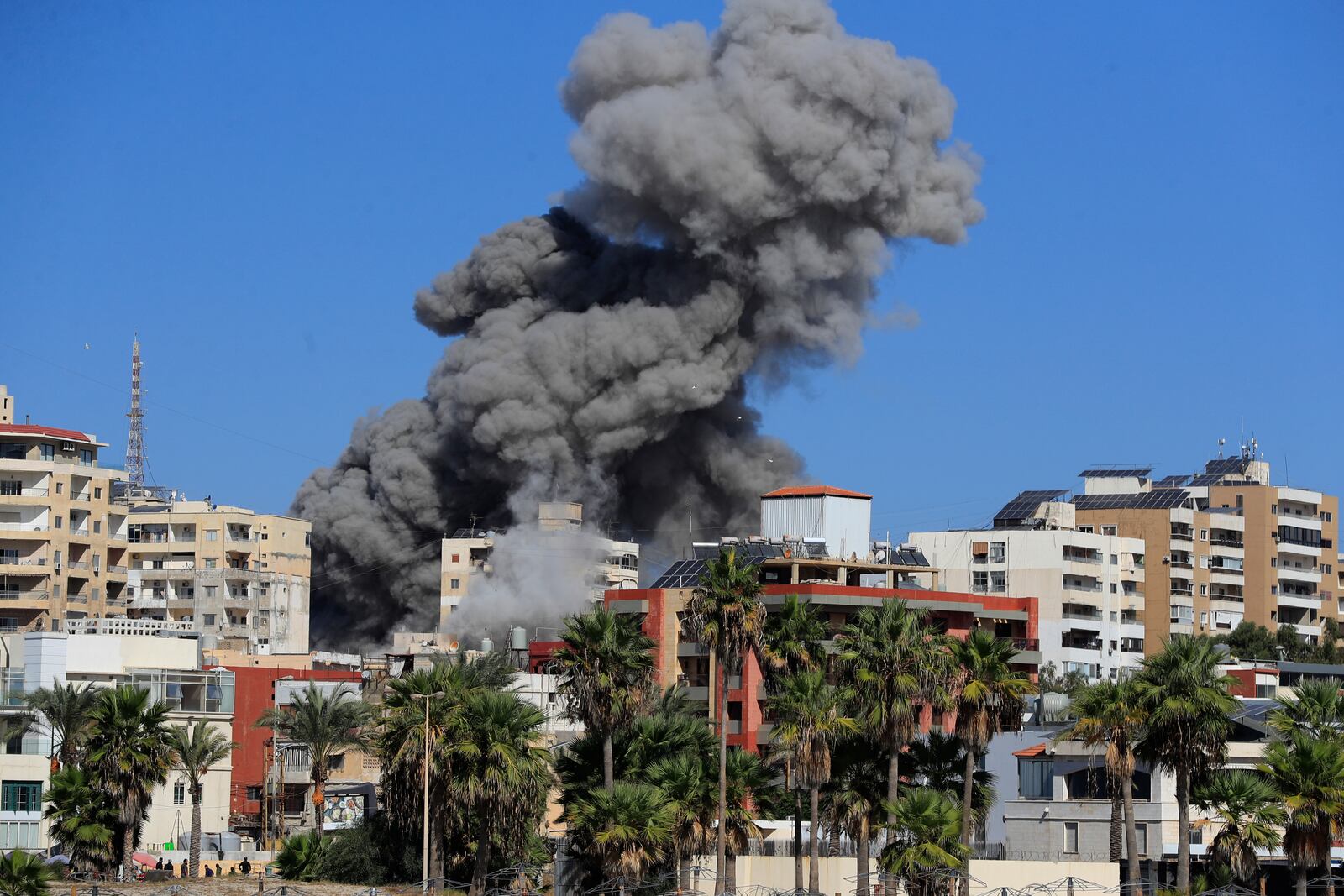 Smoke rises from buildings hit in an Israeli airstrike in Tyre, Lebanon, Wednesday, Oct. 23, 2024. (AP Photo/Mohammad Zaatari)