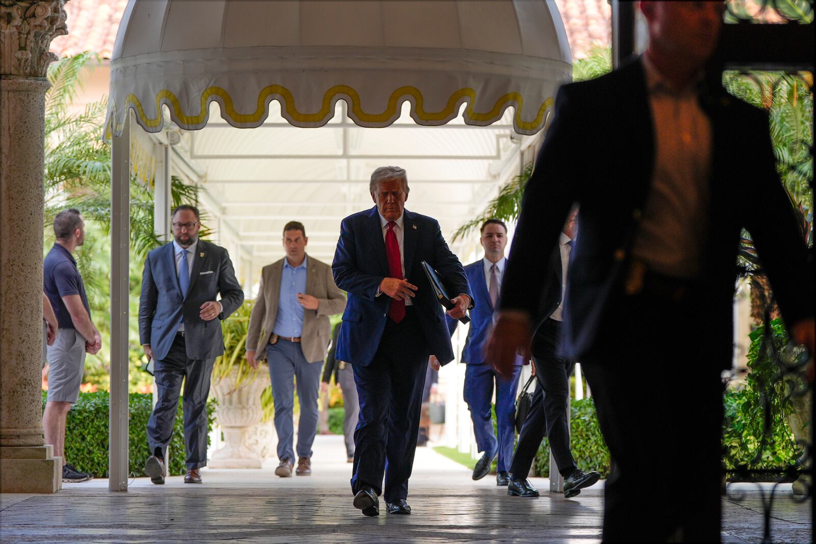 Republican presidential nominee former President Donald Trump arrives for a news conference at his Mar-a-Lago estate, Tuesday, Oct. 29, 2024, in Palm Beach, Fla. (AP Photo/Julia Demaree Nikhinson)