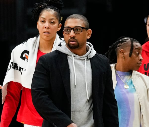 FILE - Las Vegas Aces interim head coach Tyler Marsh, center, looks on during a timeout in the second half of a WNBA basketball game against the Seattle Storm, May 20, 2023, in Seattle. (AP Photo/Lindsey Wasson, File)