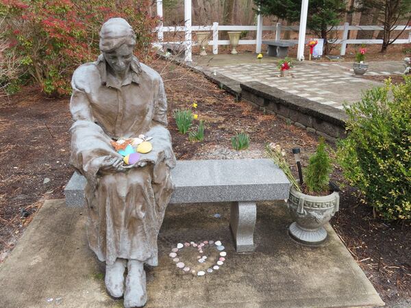 FILE - A sculpture of a grieving mother at a memorial garden in Toms River, N.J., for children who died from any cause is shown on Feb. 21, 2023. (AP Photo/Wayne Parry, File)