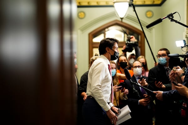 FILE - Prime Minister Justin Trudeau talks to reporters as he arrives at a caucus meeting on Parliament Hill in Ottawa on April 6, 2022. (Sean Kilpatrick/The Canadian Press via AP, File)