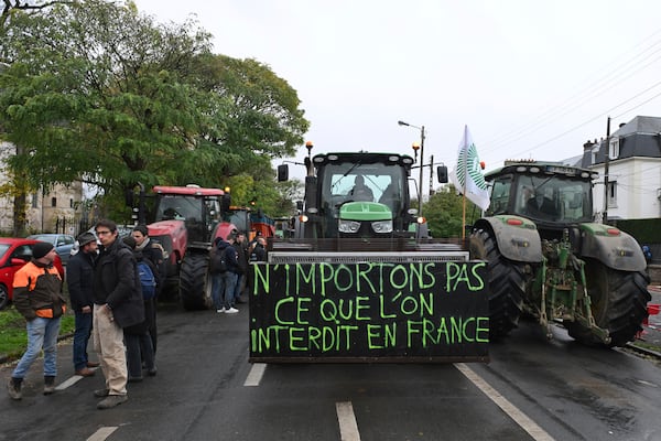 FILE - Farmers gather by their tractors before a rally against the EU-Mercosur trade agreement, Monday, Nov. 18, 2024 in Beauvais, northern France. Poster reads: Do not import what is is forbidden in France. (AP Photo/Matthieu Mirville, File)