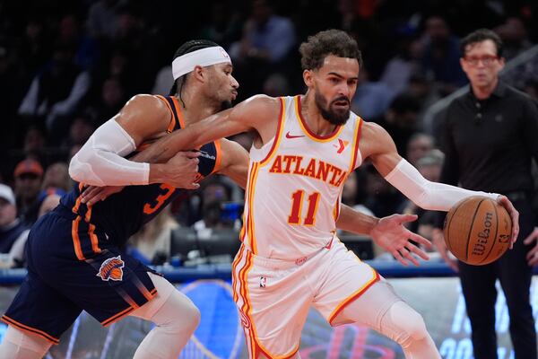 Atlanta Hawks' Trae Young (11) drives past New York Knicks' Josh Hart (3) during the first half of an Emirates NBA Cup basketball game Wednesday, Dec. 11, 2024, in New York. (AP Photo/Frank Franklin II)