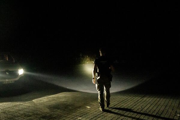 French gendarmes patrol during curfew outside Mamoudzou, Mayotte, Saturday, Dec. 21, 2024. (AP Photo/Adrienne Surprenant)