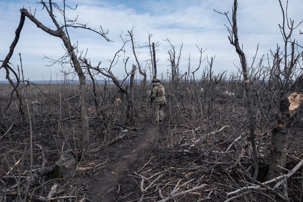 FILE - A Ukrainian soldier walks near Klishchyivka, Donetsk region, Ukraine, Monday, March 18, 2024. (Iryna Rybakova via AP, File)