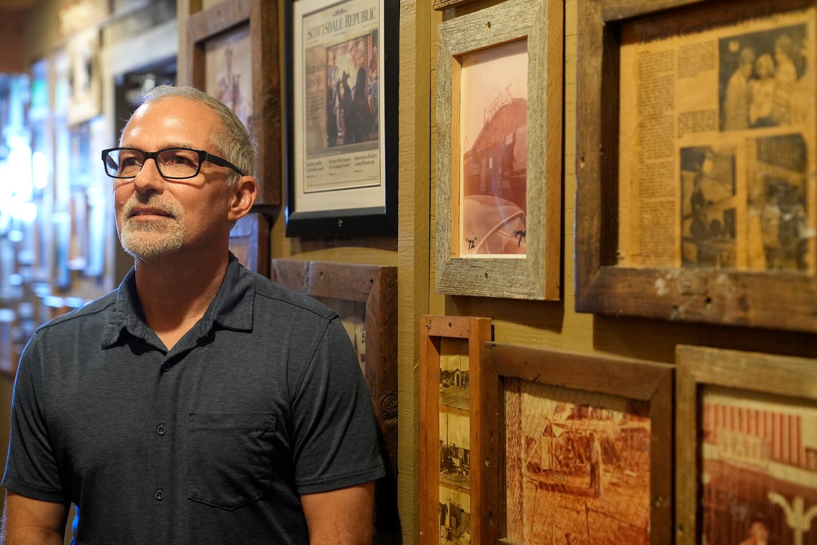 Dan Piacquadio, owner of Harold's Cave Creek Corral, poses for a photograph in his restaurant as he is very interested in the upcoming election and the results of Arizona Prop 138 on minimum wage Thursday, Oct. 3, 2024, in Cave Creek, Ariz. (AP Photo/Ross D. Franklin)