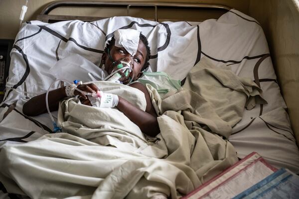 A kid wounded in the fighting between M23 rebels and Congolese armed forces lies on a bed at the Cbeca Ndosho hospital in Goma, Democratic Republic of the Congo, Thursday, Jan. 23, 2025. (AP Photo/Moses Sawasawa)