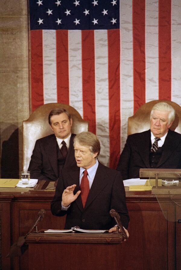 FILE - President Jimmy Carter speaks about energy before a joint session of the Congress in Washington, April 21, 1977. House speaker Thomas "Tip" O'Neill is at right, and Vice President Walter Mondale is at left. (AP Photo, File)