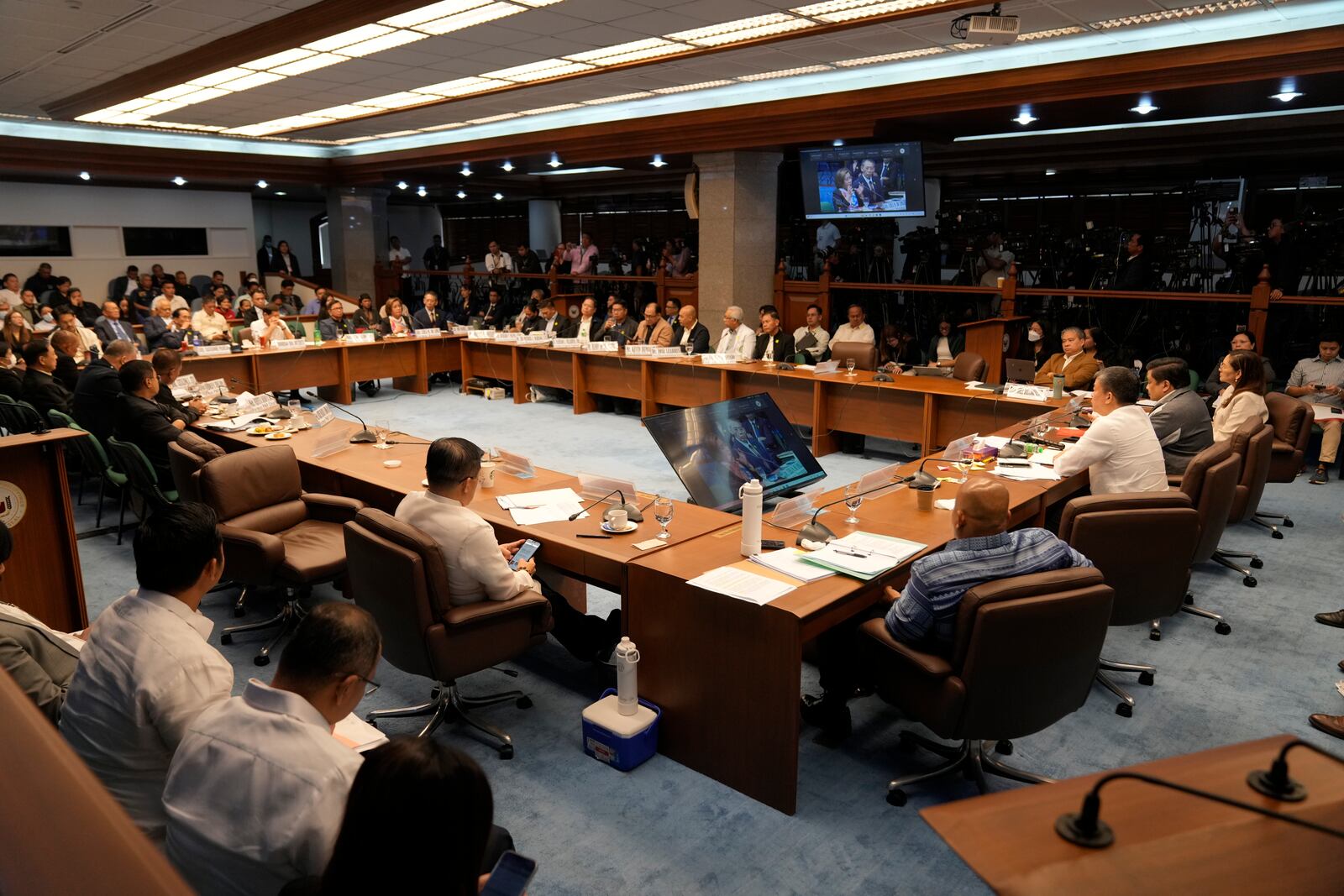 Philippine Senator Aquilino Pimentel III, right seated, leads a senate investigation on the so-called war on drugs during the administration of former Philippine President Rodrigo Duterte at the Philippine Senate Monday, Oct. 28, 2024, in Manila, Philippines. (AP Photo/Aaron Favila)