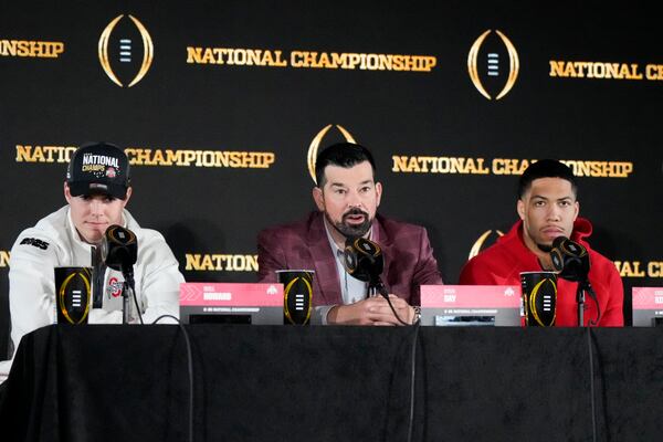 Ohio State quarterback Will Howard, head coach Ryan Day and linebacker Cody Simon participate in the winners news conference after the College Football Playoff national championship game against Notre Dame Tuesday, Jan. 21, 2025, in Atlanta. (AP Photo/Chris Carlson)