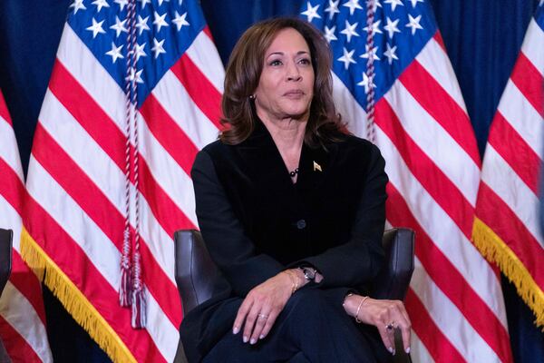 Vice President Kamala Harris listens as first lady Jill Biden speaks at the Democratic National Committee's Holiday Reception at Willard Hotel in Washington, Sunday, Dec. 15, 2024. (AP Photo/Jose Luis Magana)