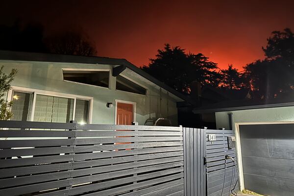 The home of Ryan Pearson, a Los Angeles-based entertainment video editor for The Associated Press, in Altadena, Calif., is seen as he and his family evacuate due to the Eaton Fire, Tuesday, Jan. 7, 2025. (AP Photo/Ryan Pearson)