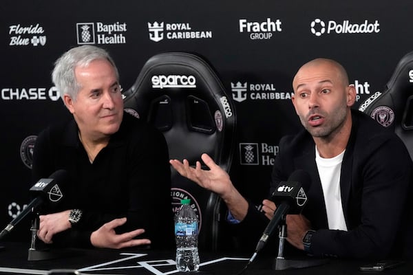 Inter Miami's new head coach Javier Mascherano, right, speaks as the team's managing owner and CEO Jorge Mas, left, looks on during an MLS soccer news conference, Tuesday, Dec. 3, 2024, in Fort Lauderdale, Fla. (AP Photo/Wilfredo Lee)