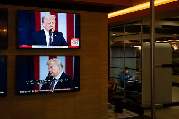 The inauguration of U.S. President Donald Trump plays live on screens in the lobby of a building in Halifax, Nova Scotia, on Monday, Jan. 20, 2025. (Darren Calabrese/The Canadian Press via AP)