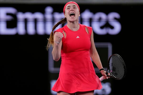 Elina Svitolina of Ukraine celebrates after defeating Jasmine Paolini of Italy in their third round match at the Australian Open tennis championship in Melbourne, Australia, Saturday, Jan. 18, 2025. (AP Photo/Vincent Thian)