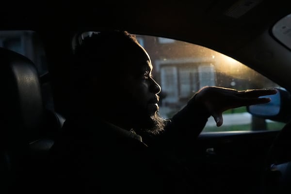 PiggyBack Network, co-founder and CEO Ismael El-Amin talks about the Piggyback ride-share program on Friday, Oct. 18, 2024, while he waits to drop off the last of two children he drove to school as part of the program in Chicago. (AP Photo/Charles Rex Arbogast)