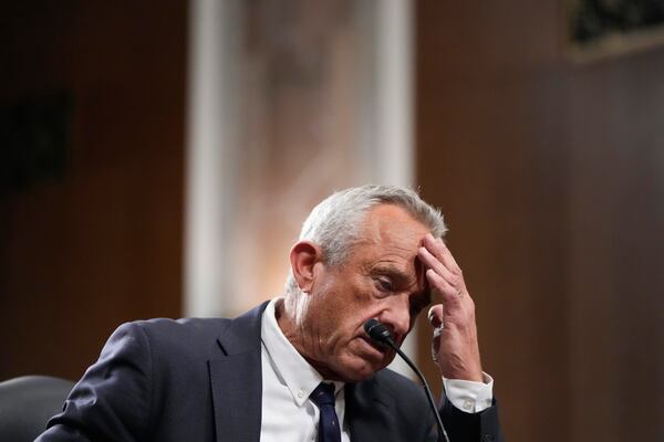 Robert F. Kennedy Jr., President Donald Trump's choice to be Secretary of Health and Human Services, appears before the Senate Finance Committee for his confirmation hearing, at the Capitol in Washington, Wednesday, Jan. 29, 2025. (AP Photo/Ben Curtis)