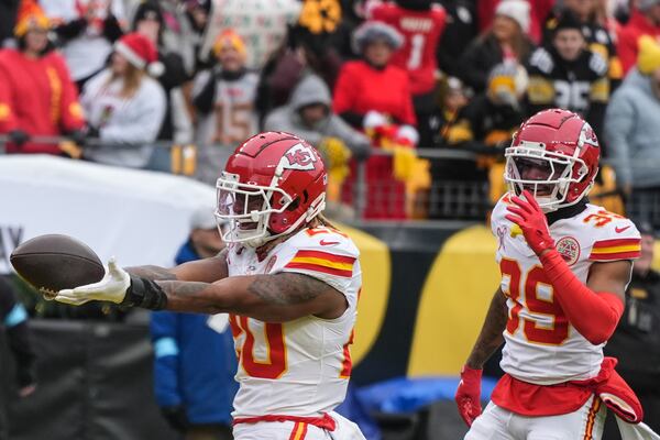 Kansas City Chiefs safety Justin Reid (20) celebrates his interception off Pittsburgh Steelers quarterback Russell Wilson during the first half of an NFL football game, Wednesday, Dec. 25, 2024, in Pittsburgh. (AP Photo/Gene J. Puskar)