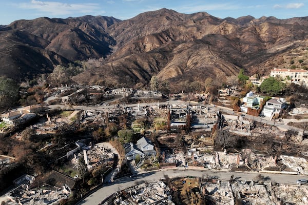 An aerial view shows the devastation left by the Palisades Fire in the Pacific Palisades section of Los Angeles, Monday, Jan. 27, 2025. (AP Photo/Jae C. Hong)