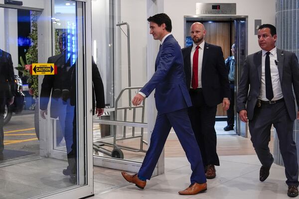 Canadian Prime Minister Justin Trudeau walks through the lobby of the Delta Hotel by Marriott, Friday, Nov. 29, 2024, in West Palm Beach, Fla. (AP Photo/Carolyn Kaster)