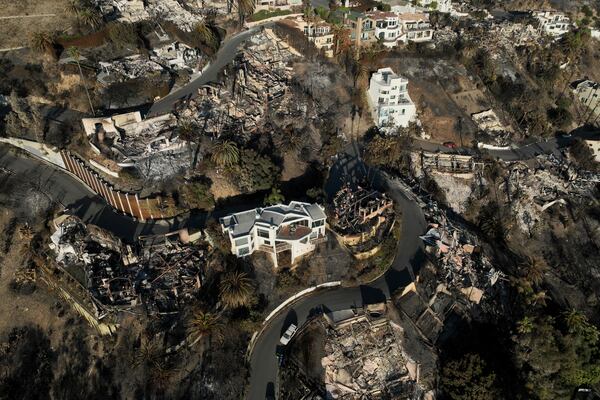 An aerial view shows the devastation by the Palisades Fire Thursday, Jan. 16, 2025 in Malibu, Calif. (AP Photo/Jae C. Hong)