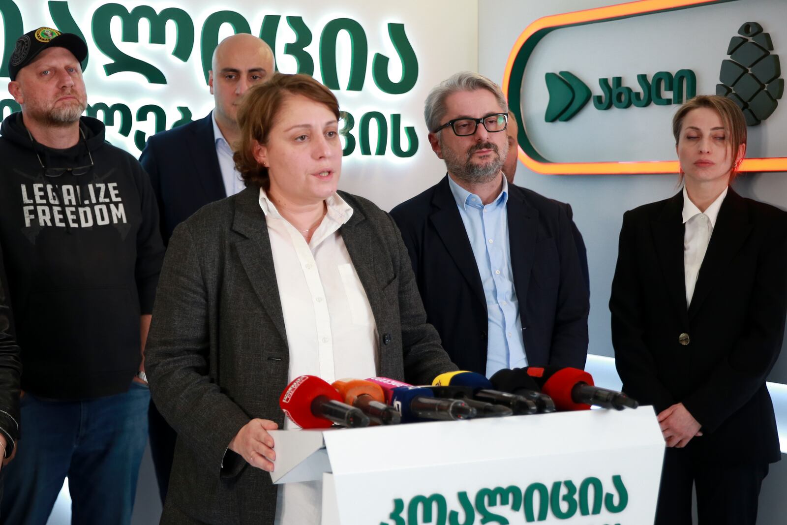 Elene Khoshtaria, chair of United National Movement, center, speaks to the media, accompanied by Zurab Japaridze, chairman of the Girchi More Freedom party, left; Nika Melia, a leader of Coalition for Changes, second left; Nika Gvaramia, leader of Coalition for Changes, second right, and Nana Malashkhia, who leads the Coalition for Change parliament list, right, at the coalition's headquarters after the parliamentary election in Tbilisi, Georgia, early Sunday, Oct. 27, 2024. (AP Photo/Zurab Tsertsvadze)