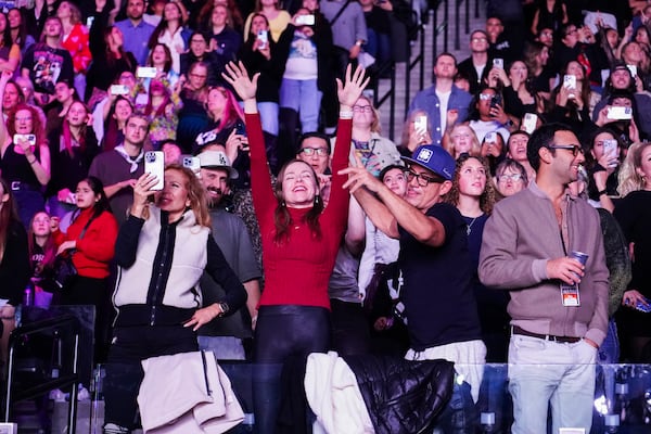 Audience members watch Katy Perry perform during the FireAid benefit concert on Thursday, Jan. 30, 2025, at Intuit Dome in Inglewood, Calif. (Photo by Jordan Strauss/Invision/AP)