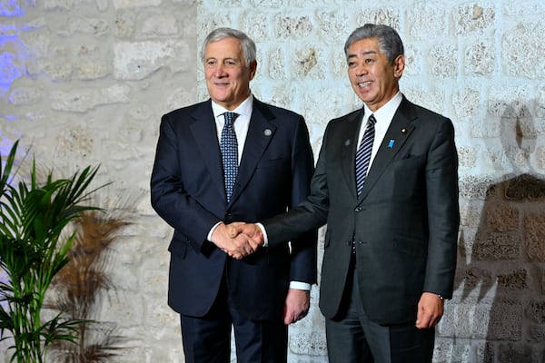 Italy's Foreign Minister Antonio Tajani, left, welcomes Japan's Foreign Minister Takeshi Iwaya at the G7 Foreign Ministers meeting in Anagni, central Italy, Monday, Nov. 25, 2024. (Andreas Solaro/Pool Photo via AP)