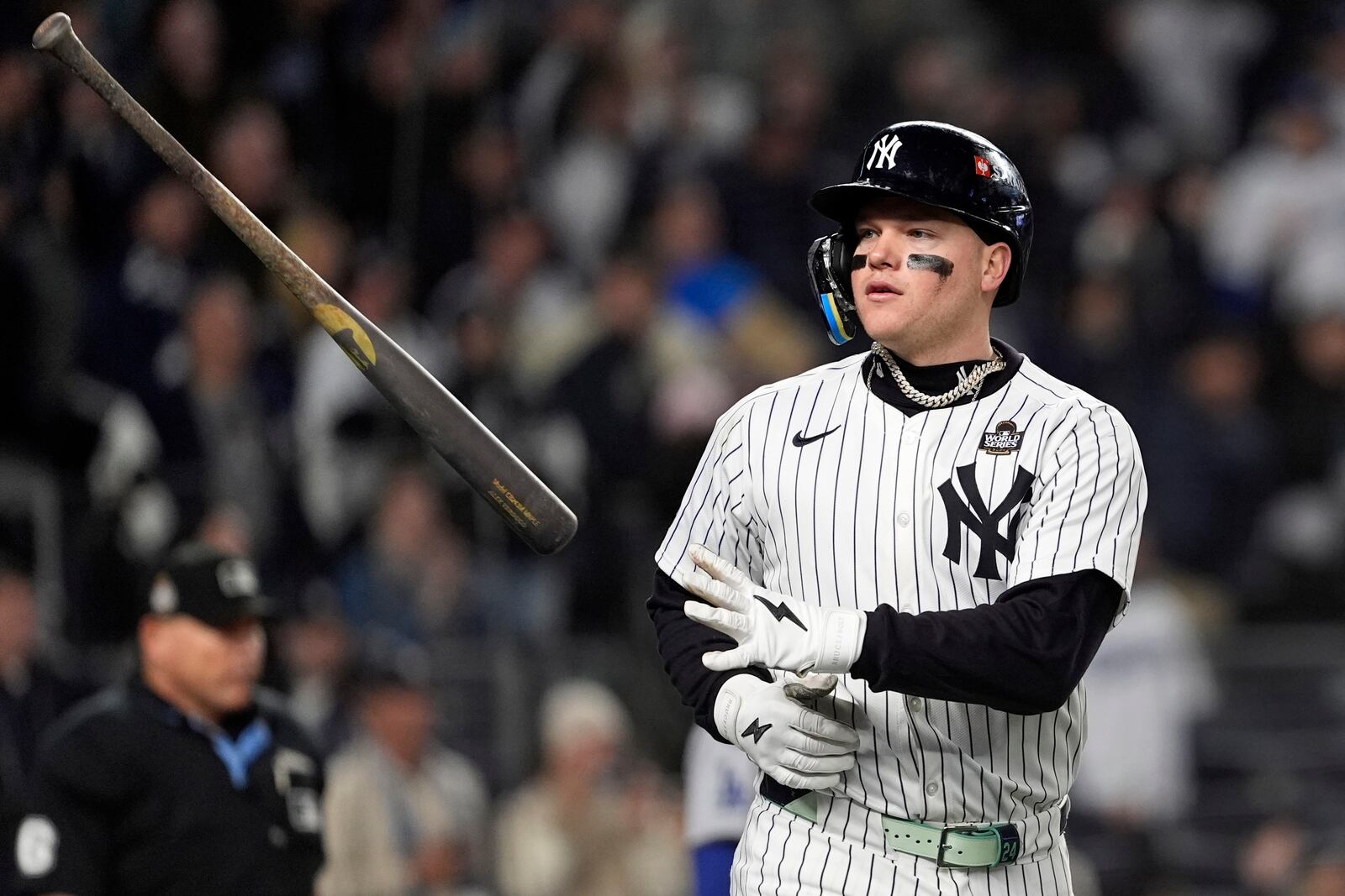 New York Yankees' Alex Verdugo tosses his bat after hitting a two-run home run against the Los Angeles Dodgers during the ninth inning in Game 3 of the baseball World Series, Monday, Oct. 28, 2024, in New York. (AP Photo/Godofredo A. Vásquez)