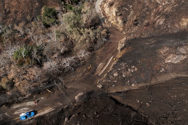 Mud covers Topanga Canyon Rd. on the Palisades Fire burn area after a series of weekend storms Monday, Jan. 27, 2025 near Malibu, Calif. (AP Photo/Jae C. Hong)